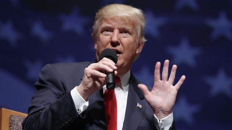 Republican presidential candidate Donald Trump speaks during a town hall,...