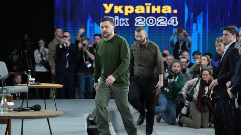 Ukrainian President Volodymyr Zelenskyy arrives before a press conference in...