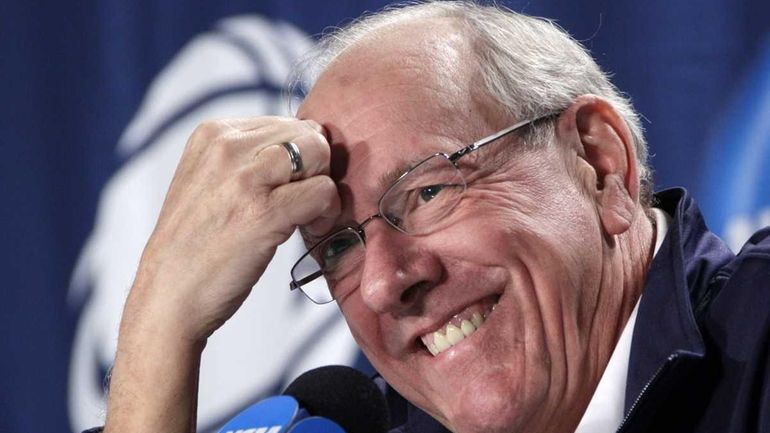 Syracuse coach Jim Boeheim reacts to a question during media...