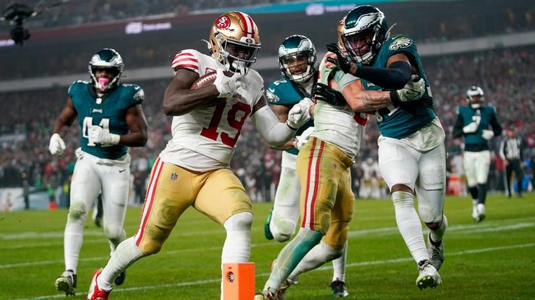 San Francisco 49ers wide receiver Deebo Samuel (19) scores a...