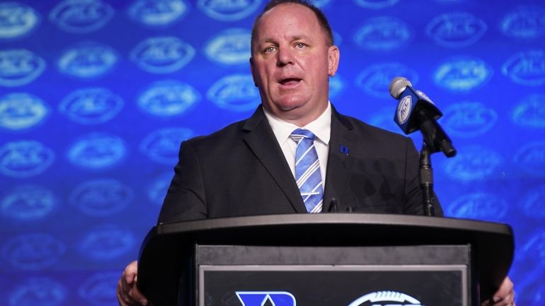 Duke head football coach Mike Elko speaks during the Atlantic...