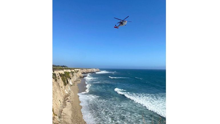 This photo taken by Cal Fire CZU, shows the scene...