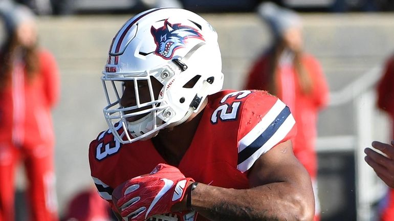 Stony Brook running back Jordan Gowins looks for running room...