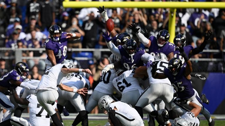 Las Vegas Raiders place kicker Daniel Carlson (2) kicks a...