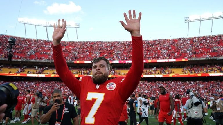 Kansas City Chiefs kicker Harrison Butker (7) walks off the...