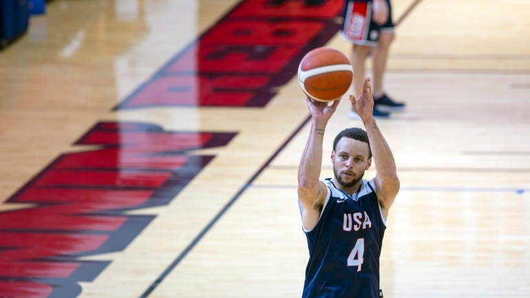 Stephen Curry of the Golden State Warriors shoots baskets during...