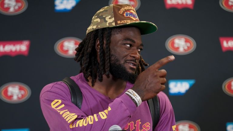 San Francisco 49ers wide receiver Brandon Aiyuk speaks to reporters...