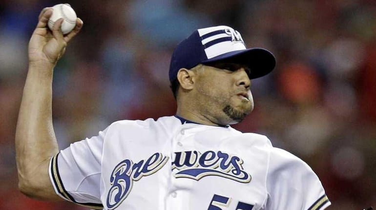 Francisco Rodriguez of the Milwaukee Brewers pitches the seventh inning...