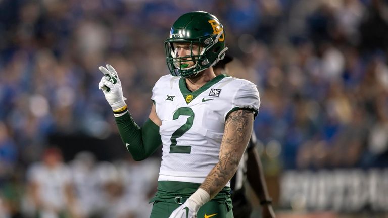 Baylor Bears linebacker Matt Jones (2) signals the play call...