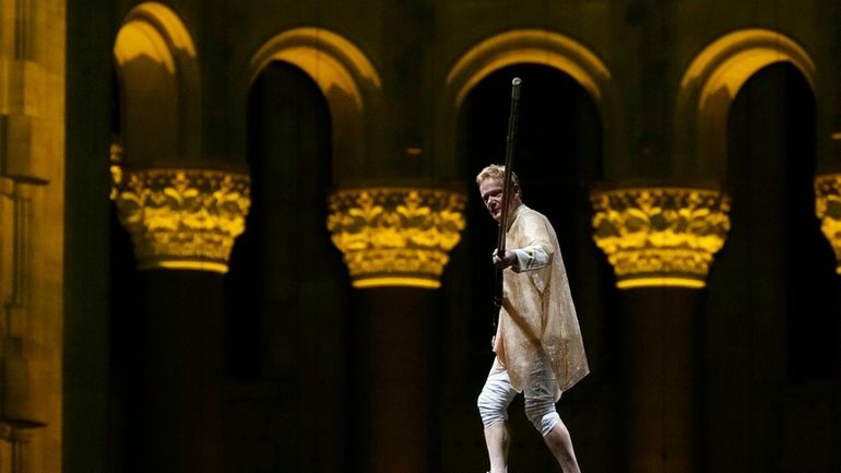 Philippe Petit walks a tightrope inside the Cathedral Church of...