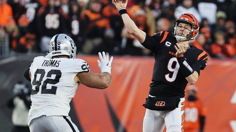 Joe Burrow #9 of the Cincinnati Bengals throws a pass...