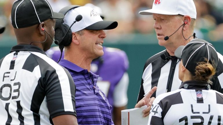 Baltimore Ravens head coach John Harbaugh argues a call during...