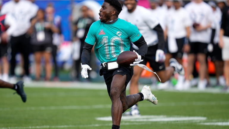 AFC wide receiver Tyreek Hill, of the Miami Dolphins, runs...