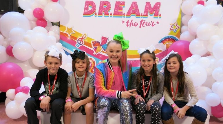 Singer JoJo Siwa with Kidsday reporters Zachary Lampert, left, Gavin...