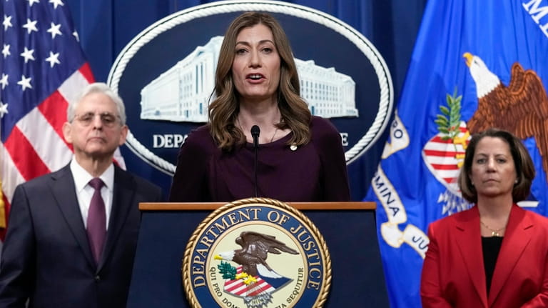 DEA Administrator Anne Milgram, center, flanked by Attorney General Merrick...