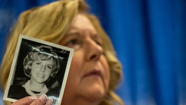 Nassau County District Attorney Anne Donnelly holds a photo of...