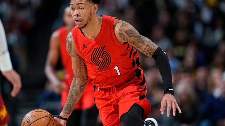 Portland Trail Blazers guard Anfernee Simons pulls in a loose...