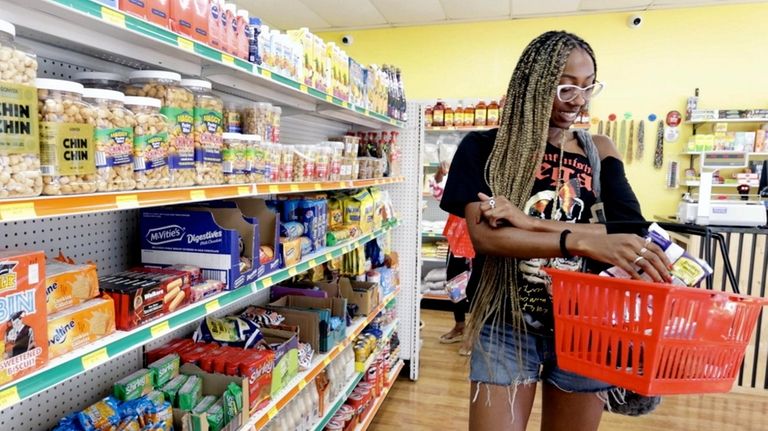 Itoro Udo-Imeh, of West Hempstead, shops at Lami African Market,...