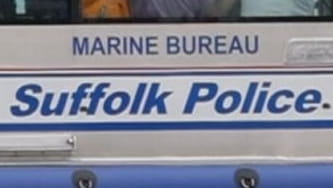 Suffolk County Police Marine Bureau officers rescued four canoers from Long...