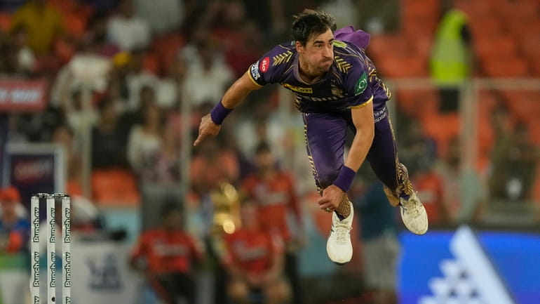 Kolkata Knight Riders' Mitchell Starc bowls a delivery during the...