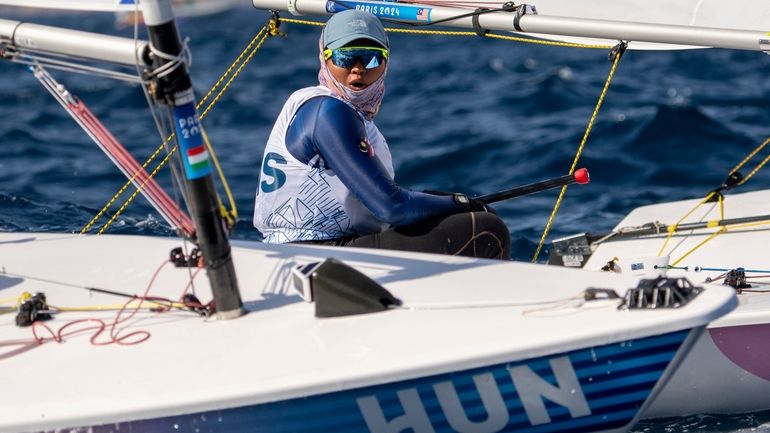 Malaysia's Nur Shazrin Binti Mohamad Latif reacts as Hungary's boat...