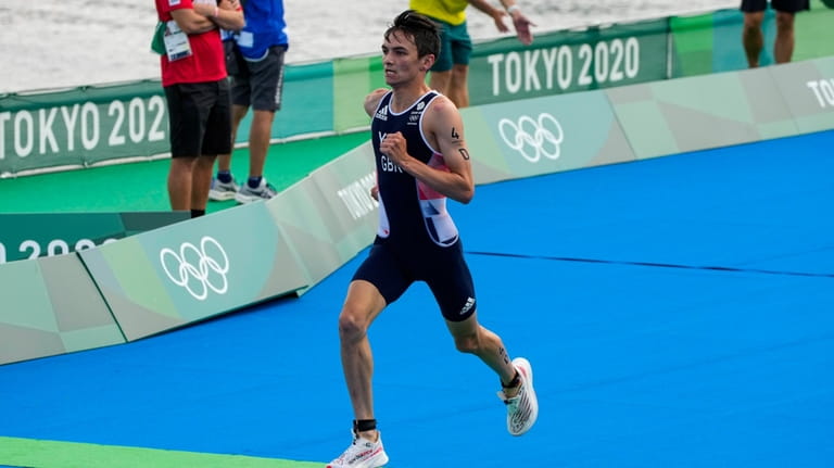 Alex Yee of Britain runs as he competes during the...