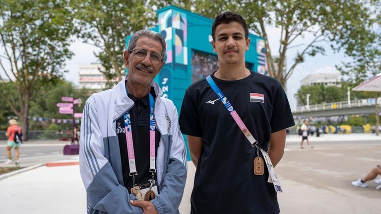 Yemeni swimmer Yusuf Marwan, right, poses for a photo with...