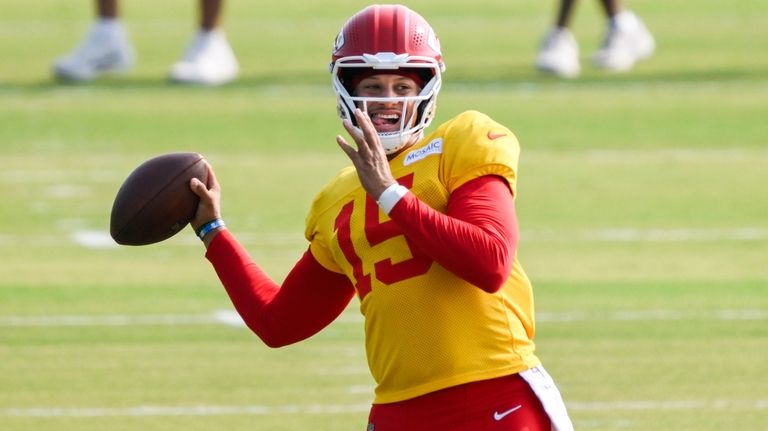 Kansas City Chiefs quarterback Patrick Mahomes throws during a drill...