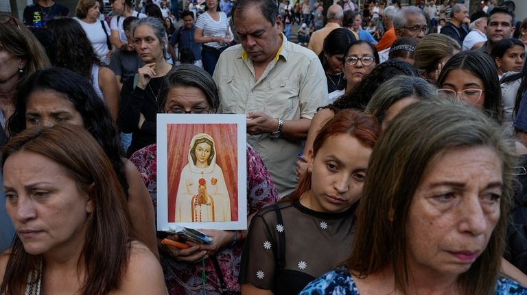 Family members of those detained amid a government crackdown on...