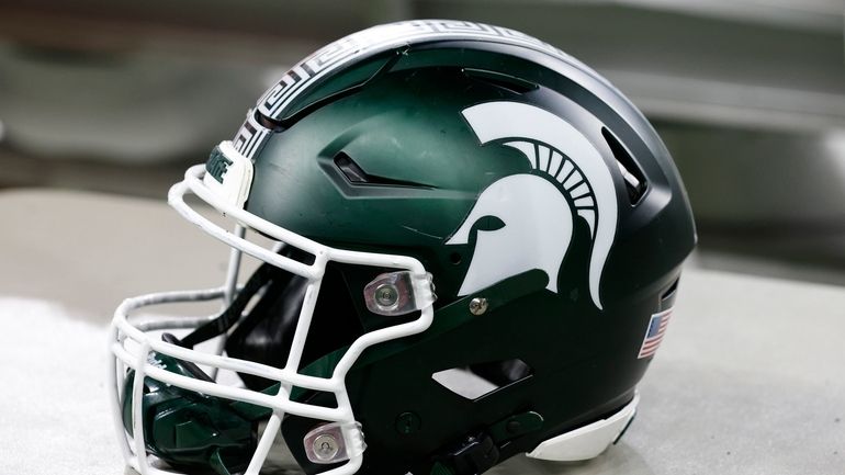 A Michigan State football helmet is seen during an NCAA...