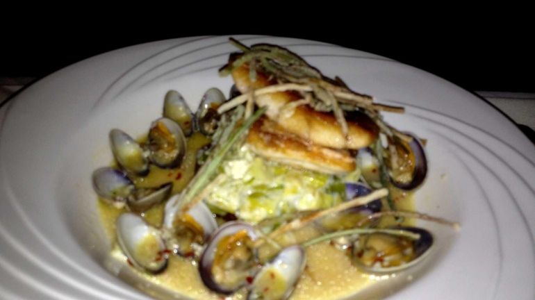 Pan-seared red snapper is boosted by leeks and clams at...