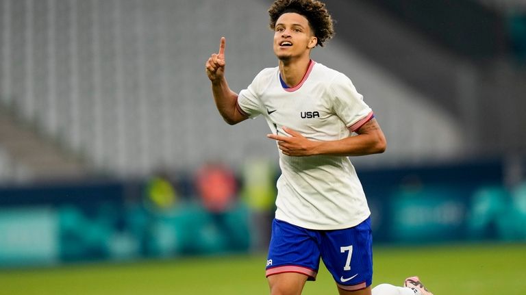 United States' Kevin Paredes celebrates scoring his side's 3rd goal...