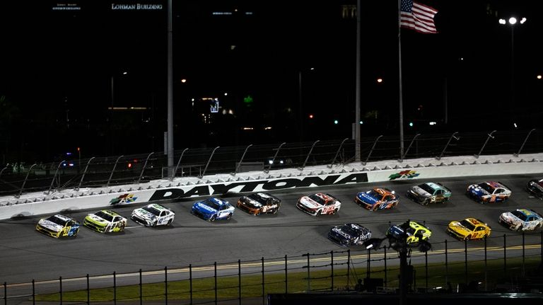 Michael McDowell (34) leads drivers through Turn 4 during a...