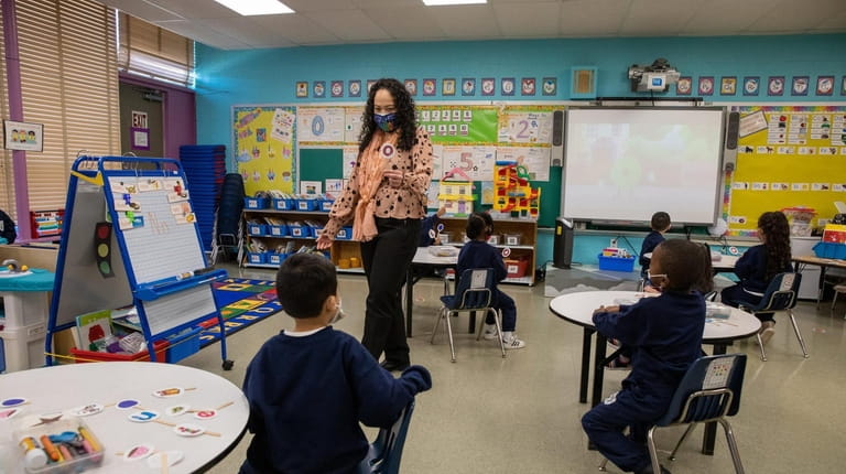 Celica Villegas-King teaches pre-K students at Our Lady of Guadalupe School...