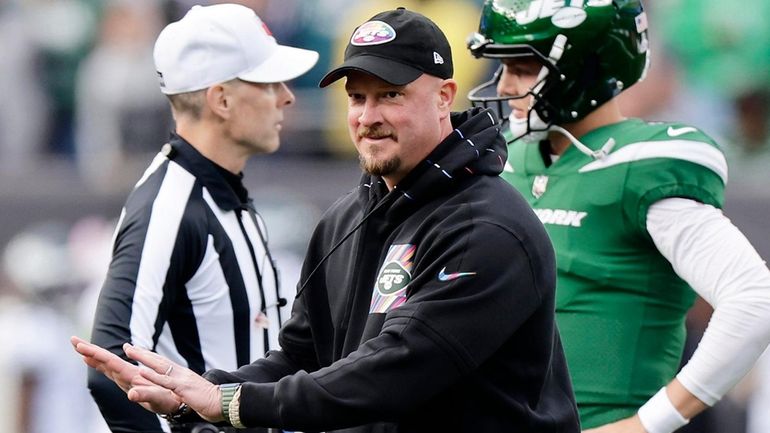 New York Jets offensive coordinator Nathaniel Hackett looks on before...