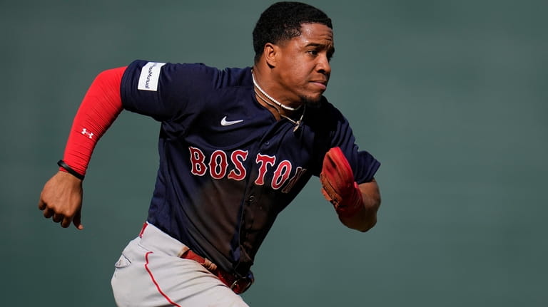 Boston Red Sox players, from left, Enmanuel Valdez, Enrique