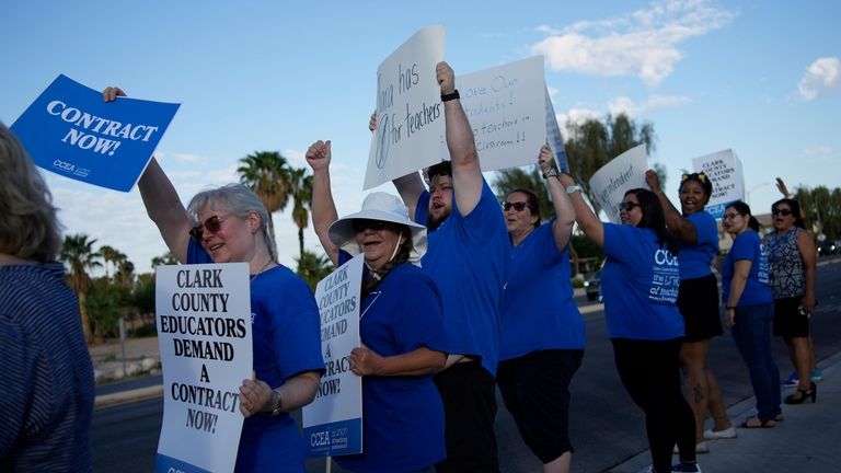 Teachers and members of the Clark County Education Association rally...