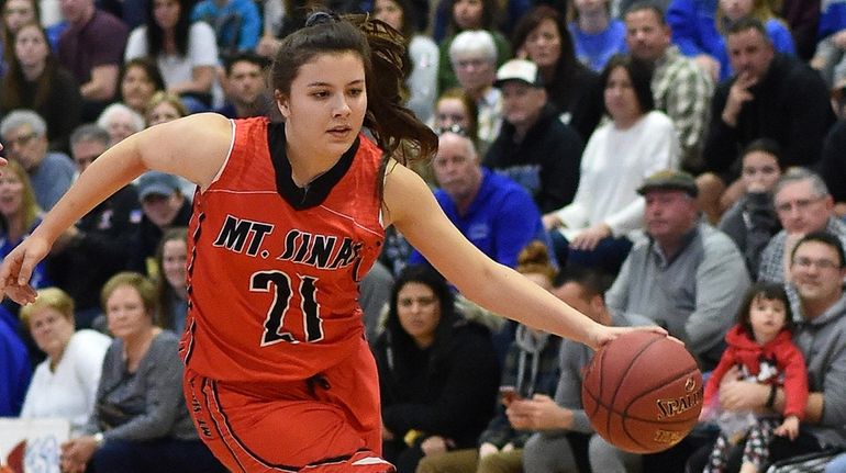 Gabby Sartori #21 of Mt. Sinai dribbles downcourt during the...