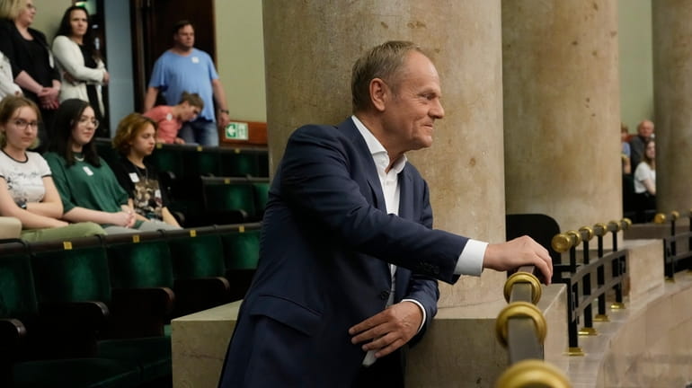 Poland's opposition leader and former prime minister, Donald Tusk, watches...