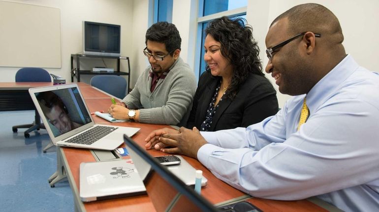 From left to right: Erick Marroquin, 27, co-director of the...