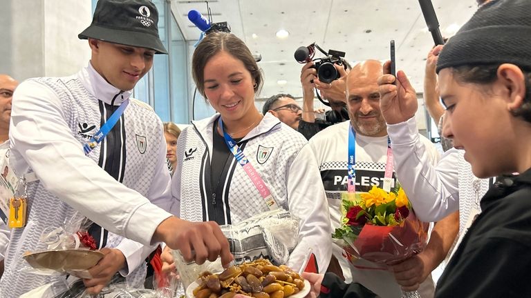 Palestinian athletes Yazan Al Bawwab and Valerie Tarazi try a...