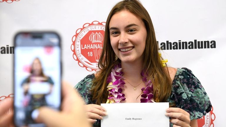 Lahainaluna High School 2024 graduate Emily Hegrenes poses with her...