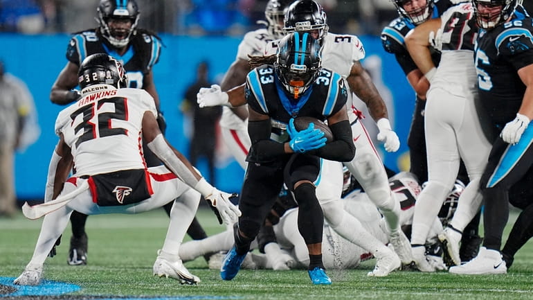 D'Onta Foreman leads Panthers past rival Falcons in rain - Newsday