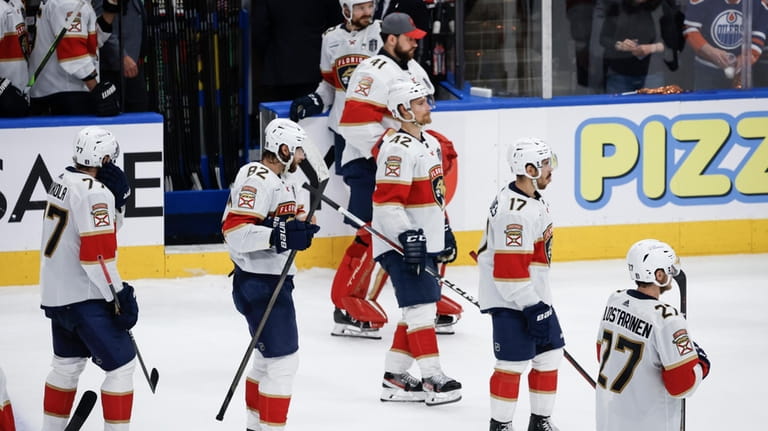 Florida Panthers players prepare to leave the ice after Game...