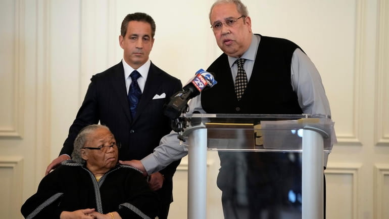Sam Lemon, right, speaks during a news conference with Susie...