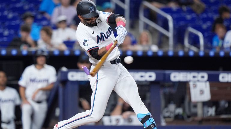 Miami Marlins' Derek Hill hits a grand slam scoring Jonah...