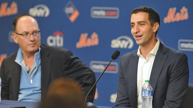 New Mets President of Baseball Operations David Stearns, right, sits...