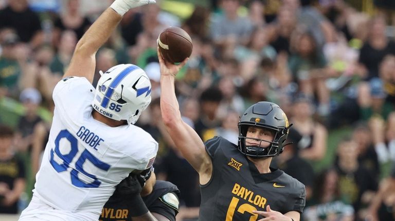 Baylor quarterback Sawyer Robertson throws downfield over Air Force defensive...