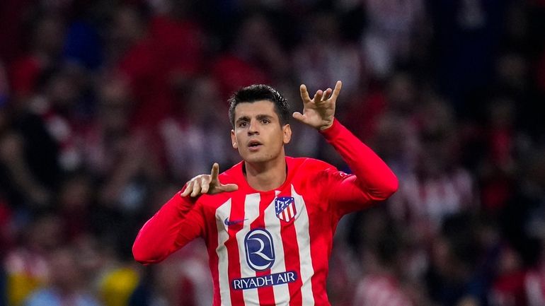 Atletico Madrid's Alvaro Morata celebrates after scoring his side's third...