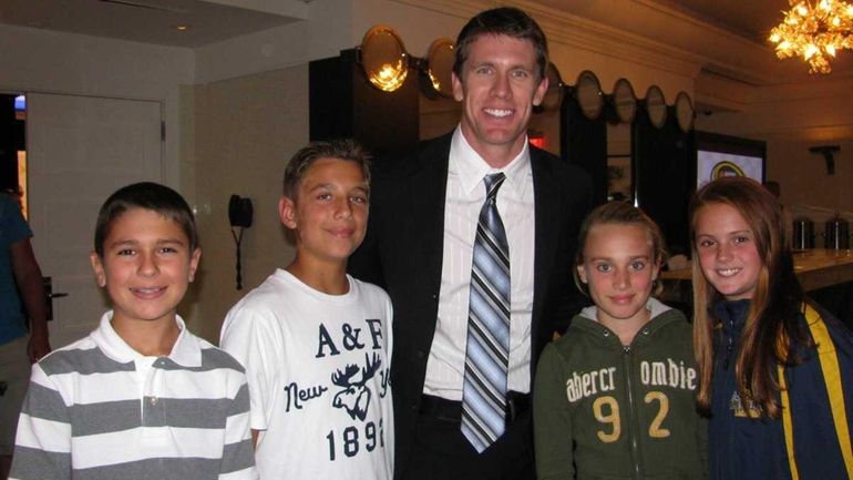 NASCAR driver Carl Edwards with Kidsday reporters, from left, Danny...